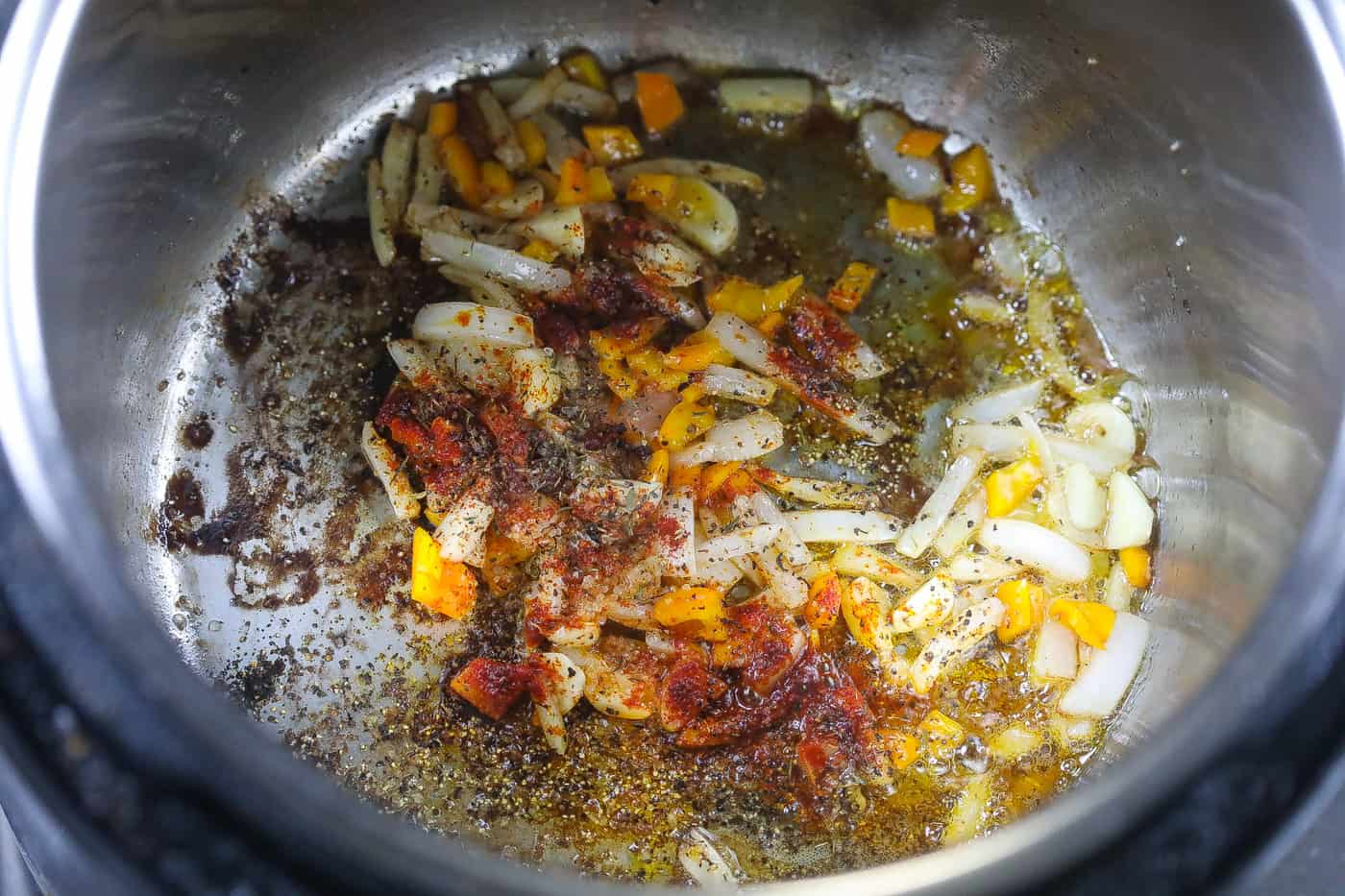 onions and peppers sauteing in instant pot
