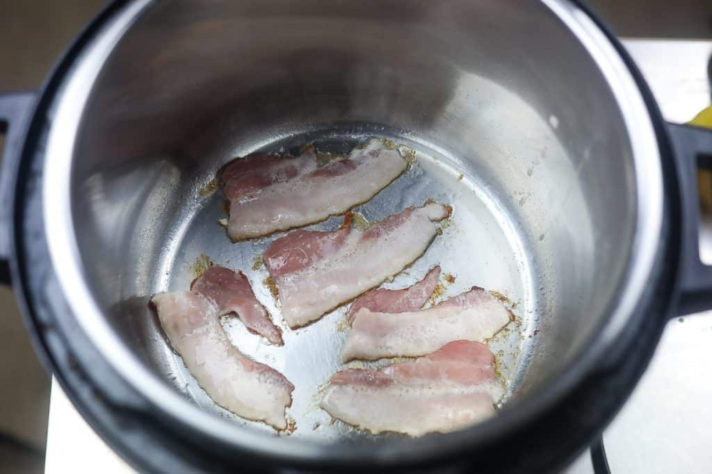 bacon cooking in pot