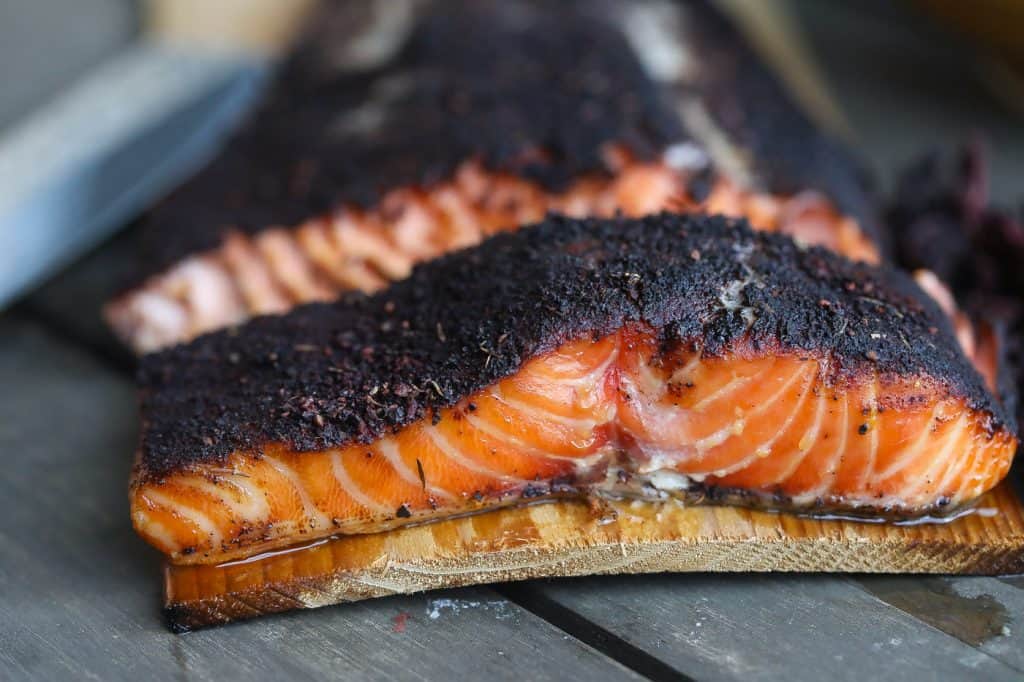 cedar plank grilled salmon on a table