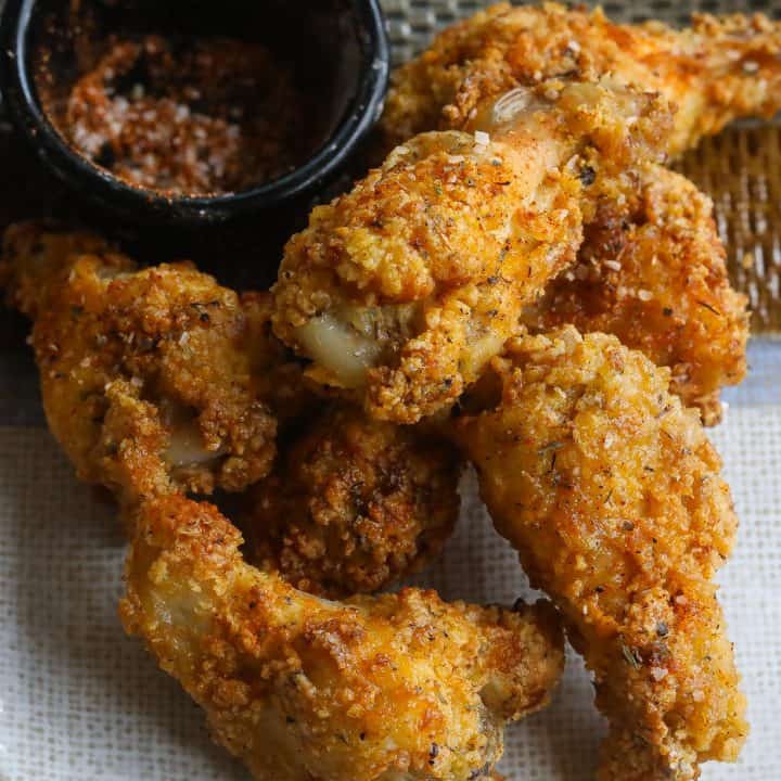 crispy chicken wings on a plate with dry spices