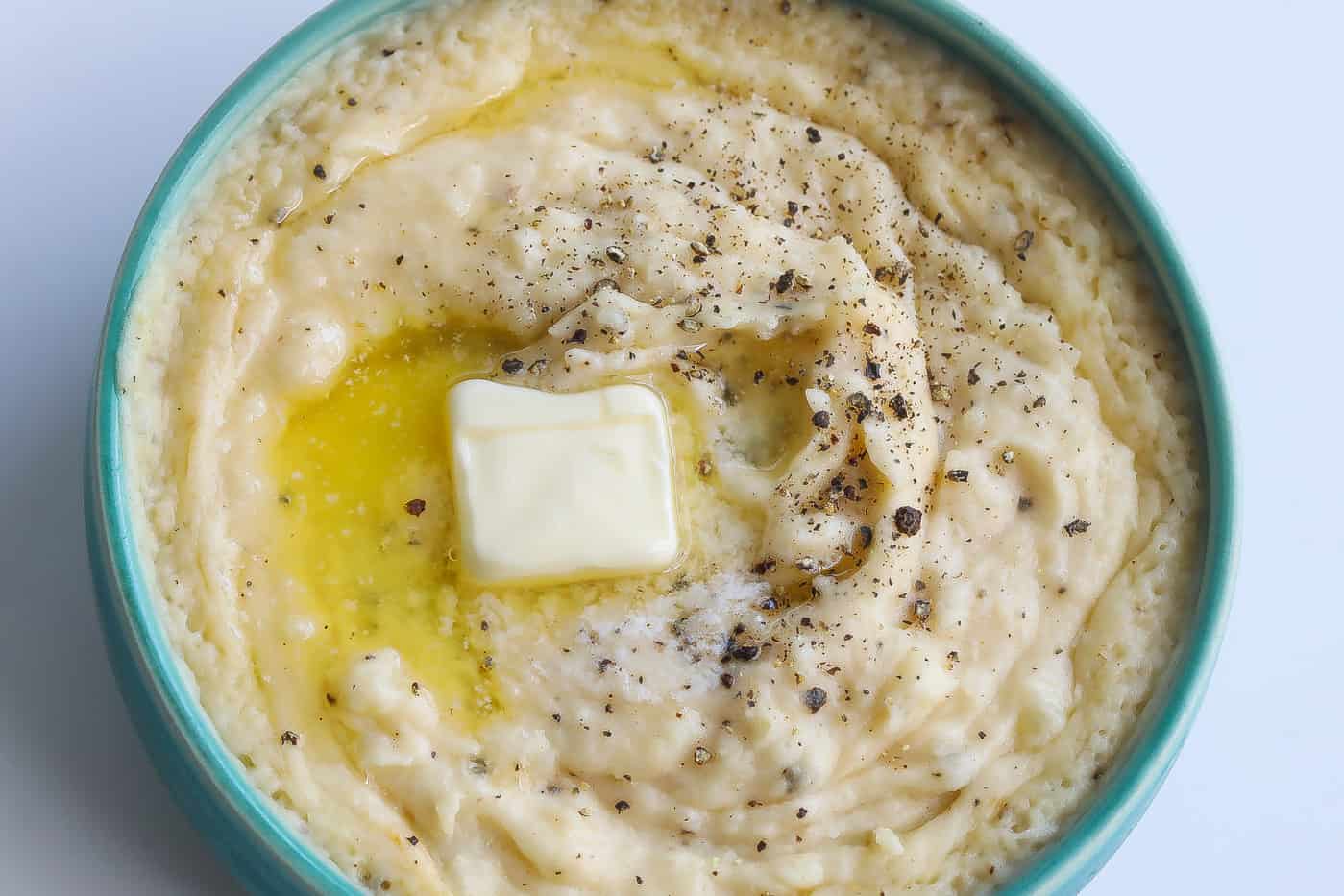 mashed potatoes with butter in blue bowl