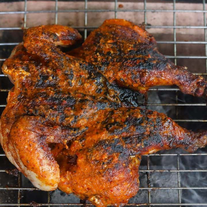chicken grilling over flame