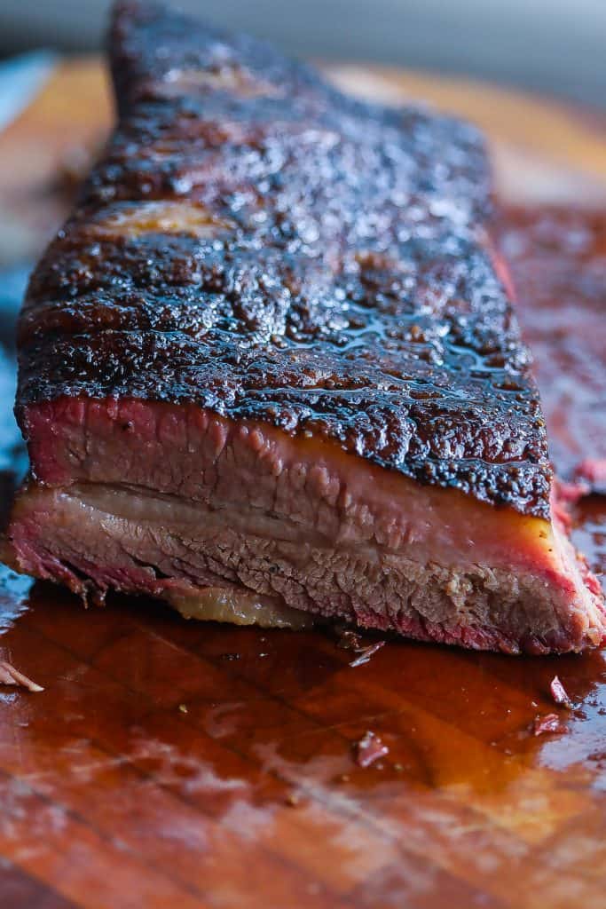 smoked brisket on a cutting board