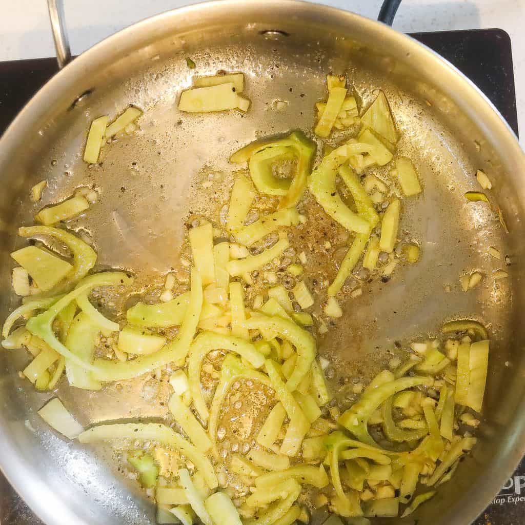 fennel sauteing in a pan