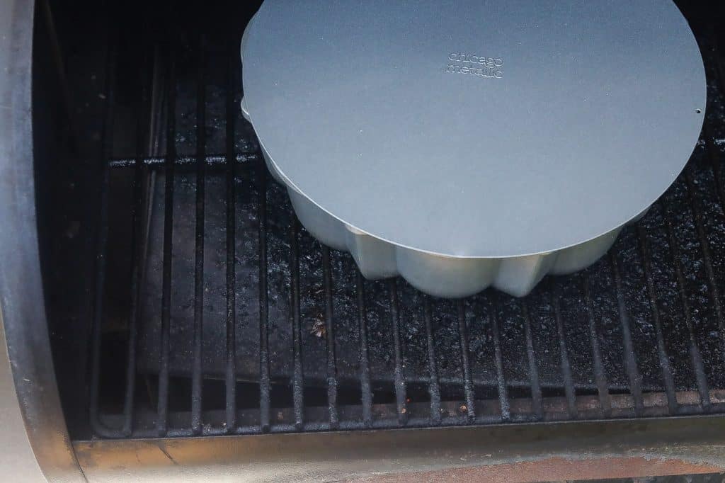 pan sitting inside grill covered