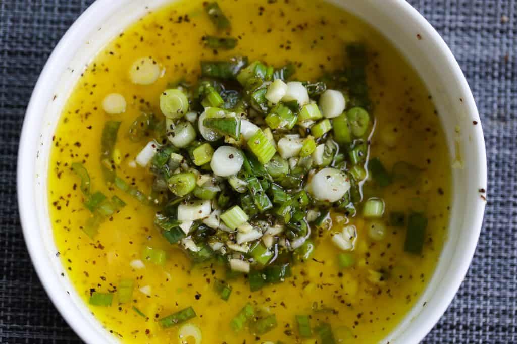 green onion vinaigrette in a white bowl