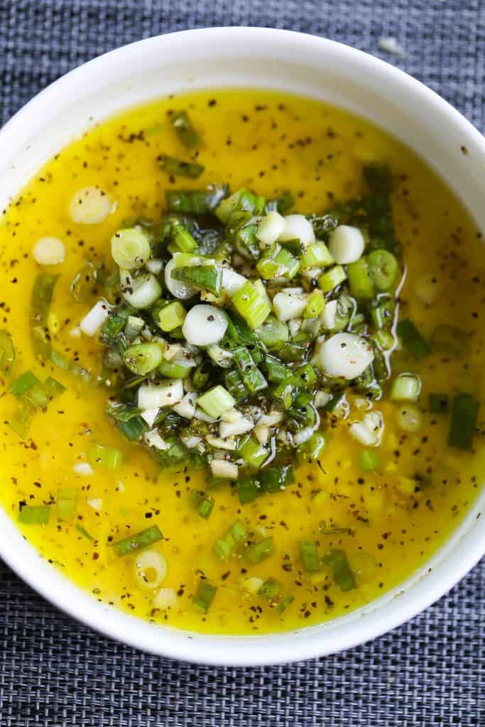 green onion and ginger vinaigrette in a white bowl