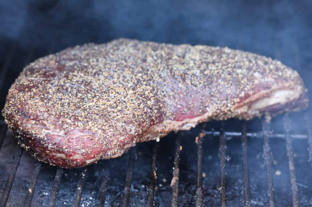 tri tip steak cooking in smoker