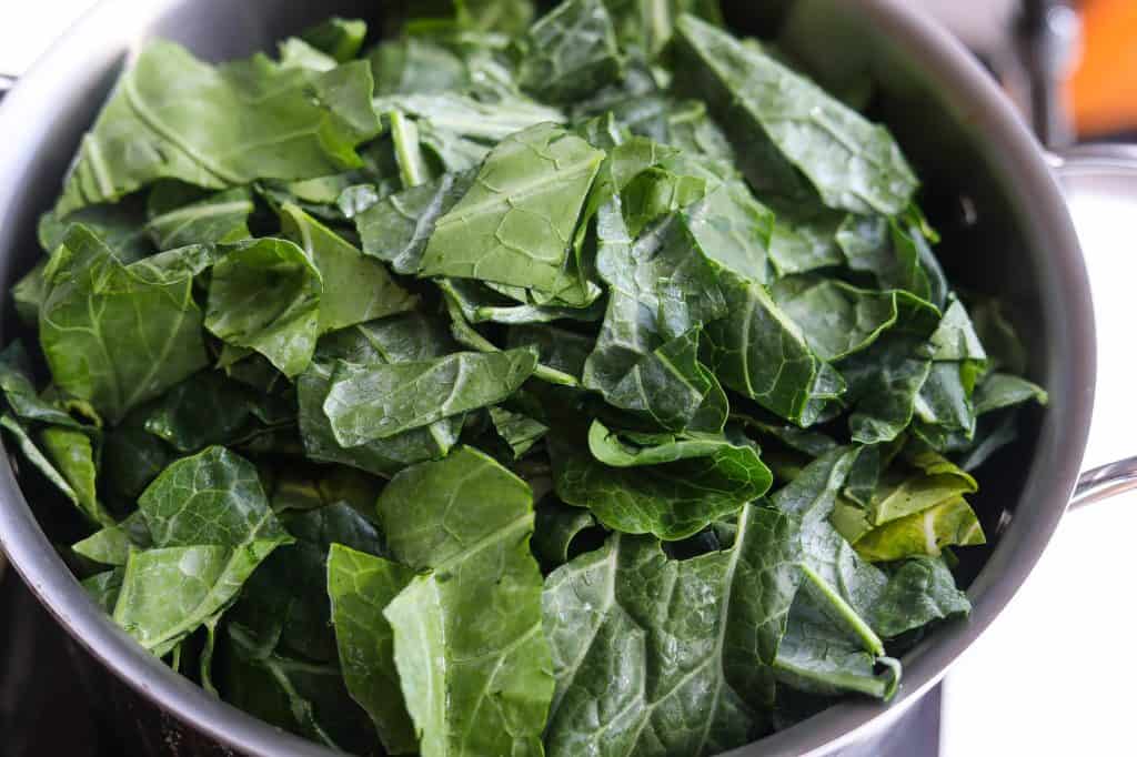 chopped greens in pot