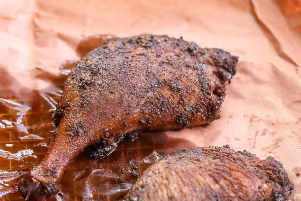 smoked duck with jerk seasoning on butcher paper