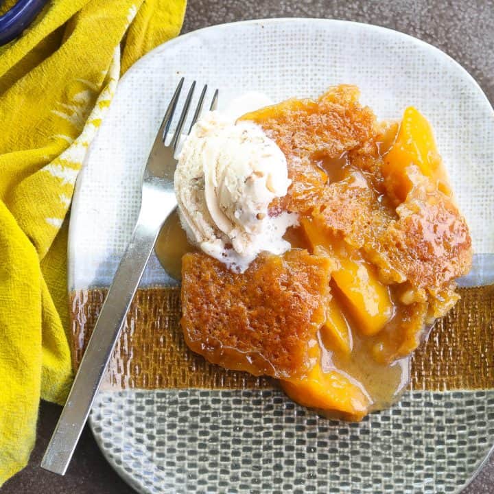 peach cobbler on a tri-color plate