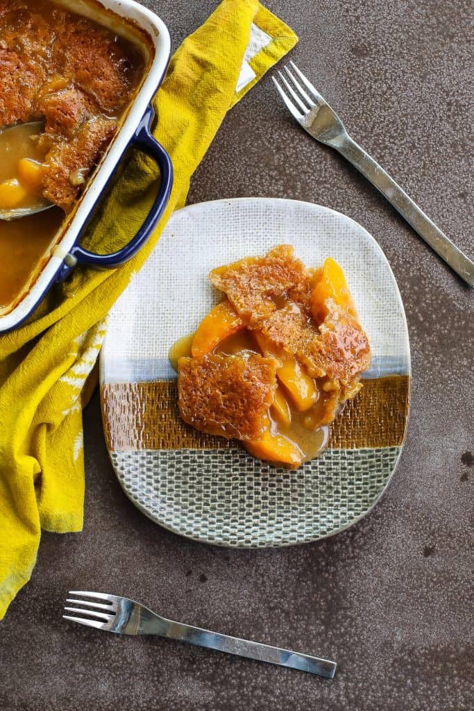 peach cobbler on a tri-color plate