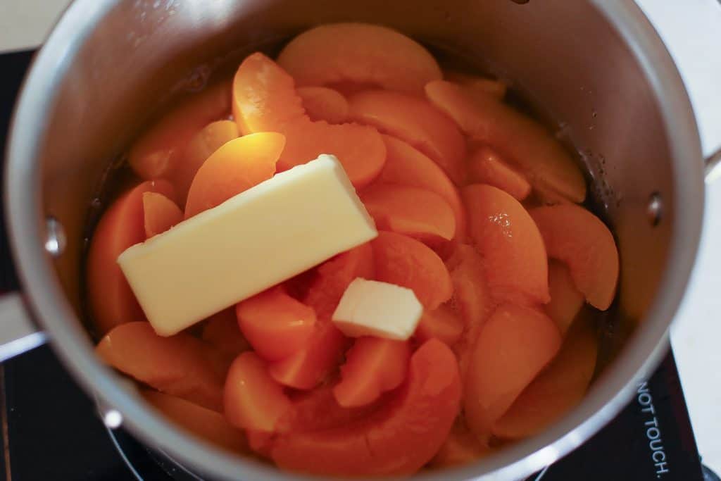 peaches and butter in pot