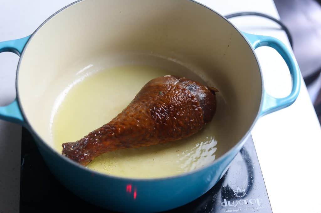turkey leg cooking in pot