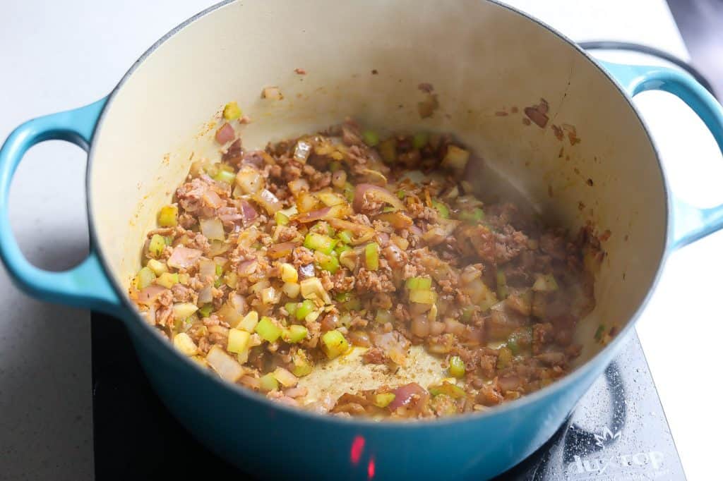 vegetables and ground turkey cooking in a pot