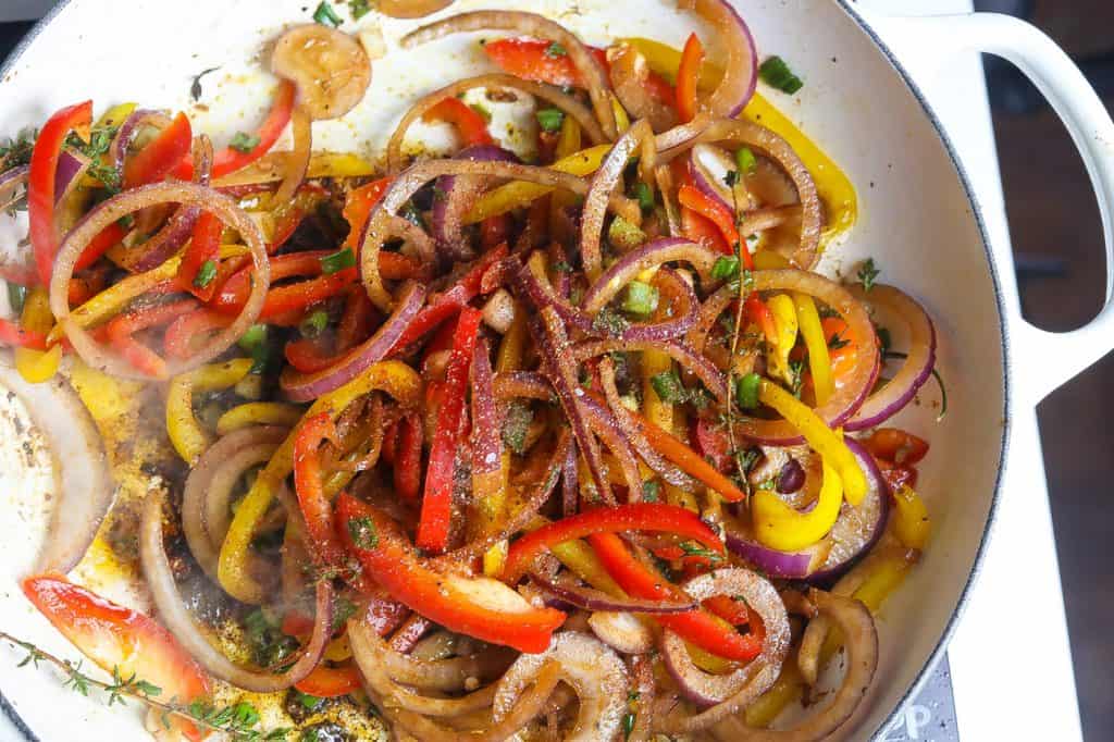 chicken in pan with peppers