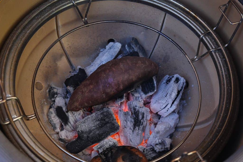 purple sweet potato cooking on charcoals