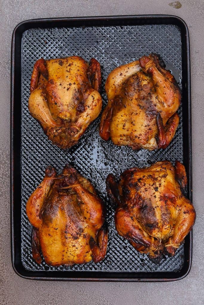 four cornish hens on a tray