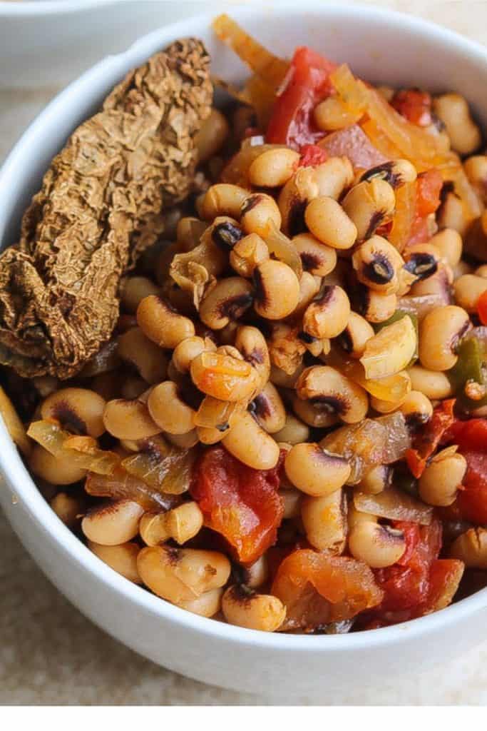 black eyed peas and dried chipotle pepper in a white bowl