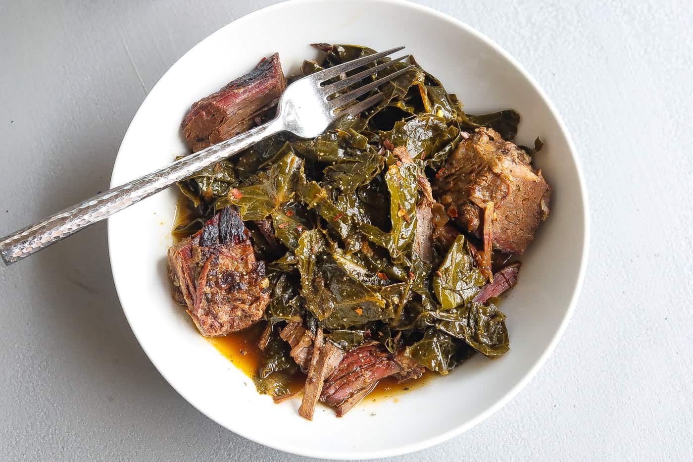 collard greens with brisket in bowl