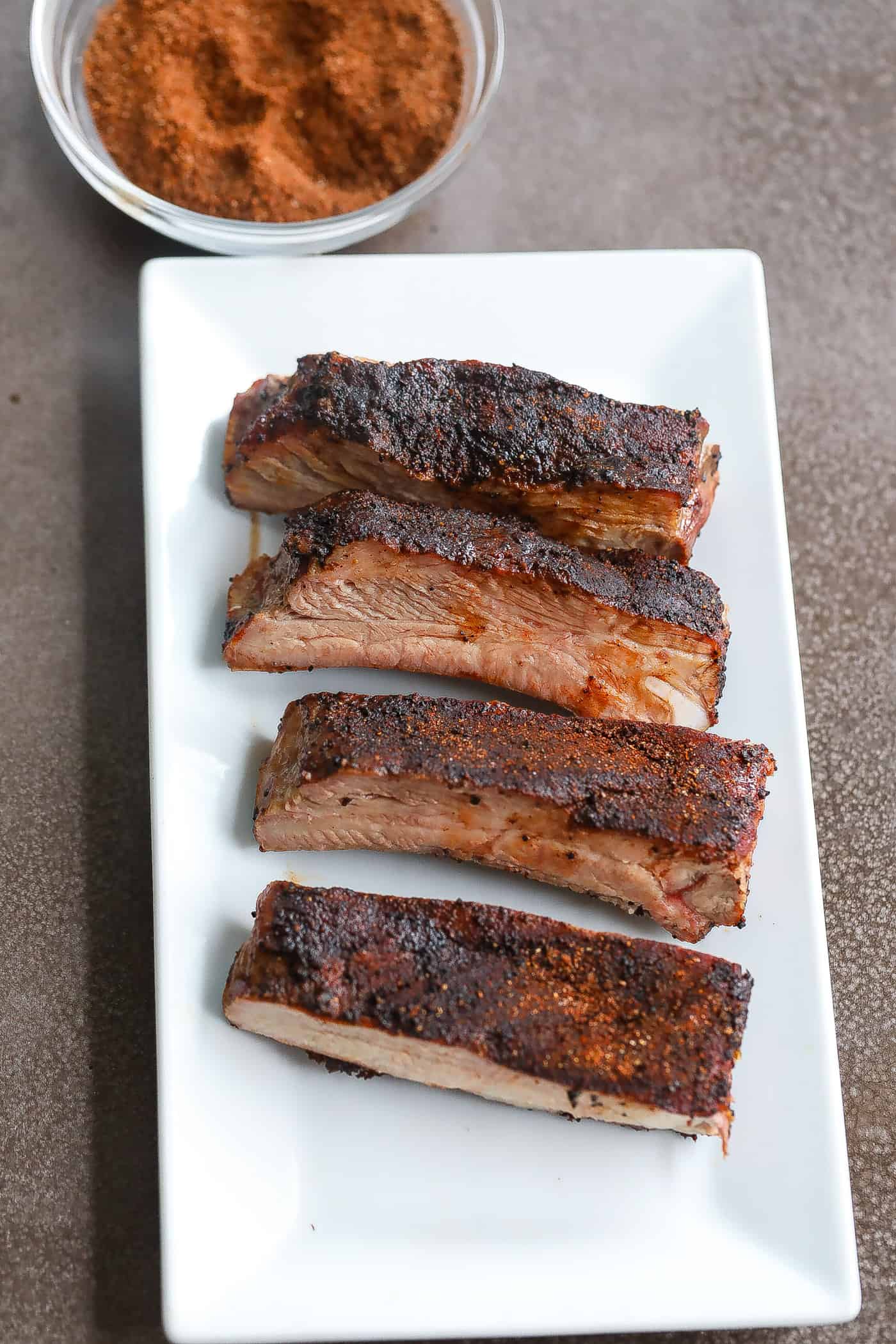 smoked spare ribs on white plate