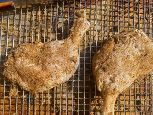 duck marinating on a cooling rack