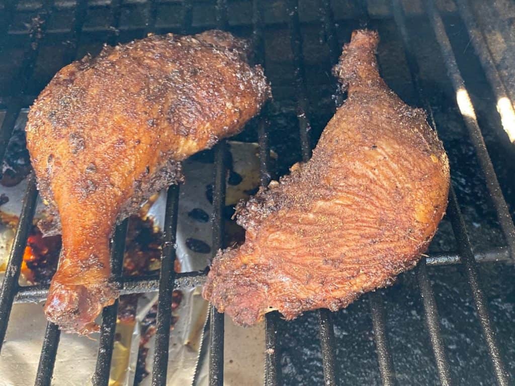 jerk duck smoking on grill