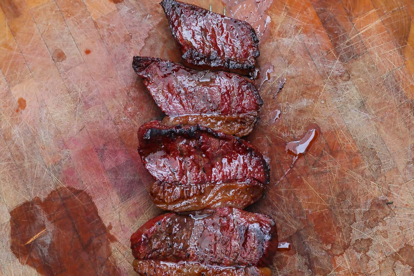 grilled picanha steak on cutting board