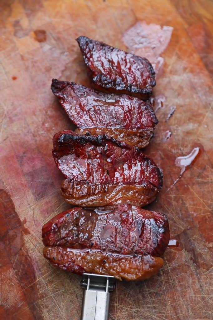 grilled picanha steak on cutting board