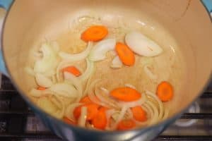 onions and carrots in a pot