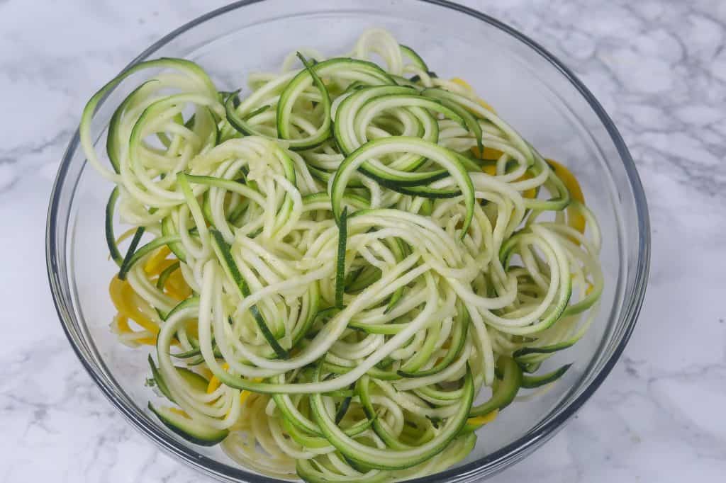 raw zucchini noodles in a bowl