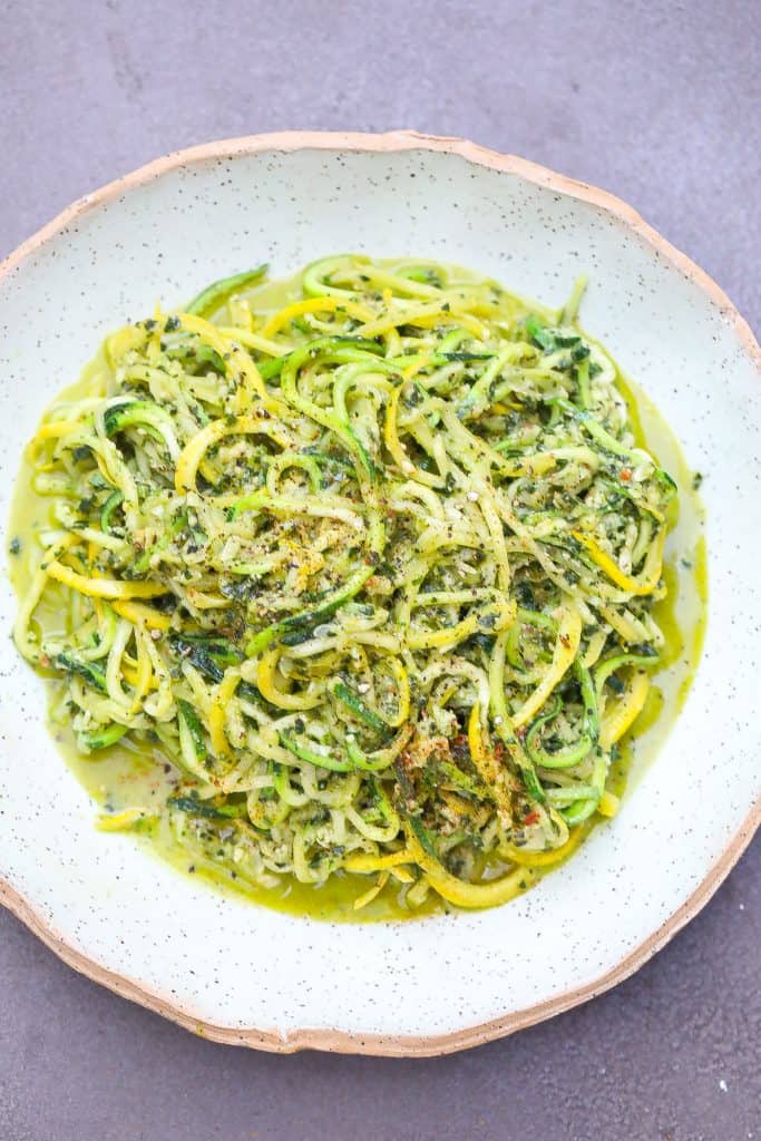 zucchini pasta on a green plate