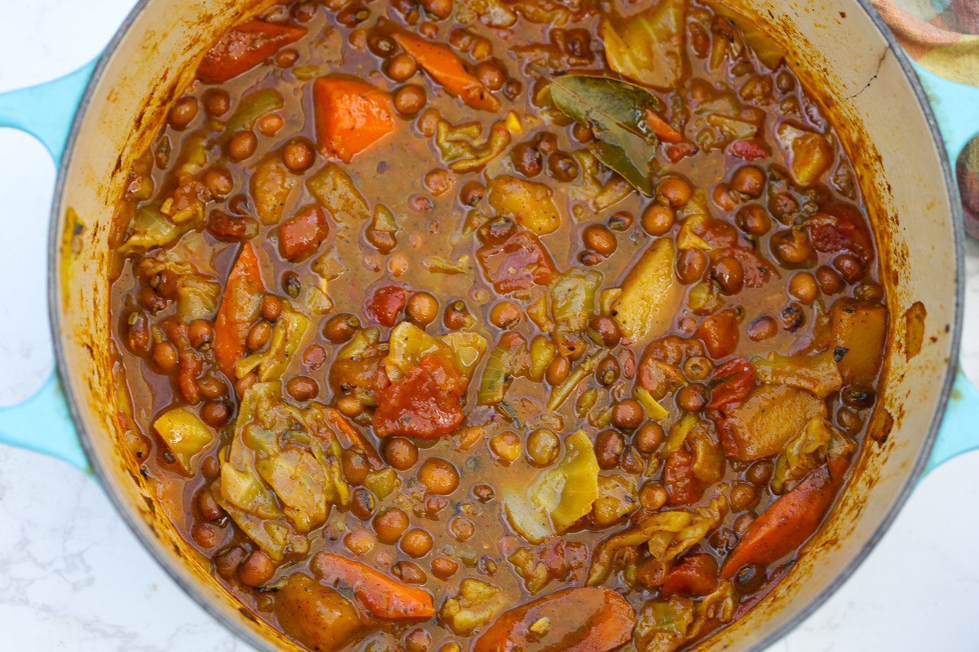 pigeon pea stew in a blue pot