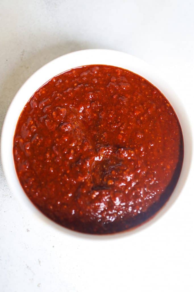 harissa paste in shallow white bowl