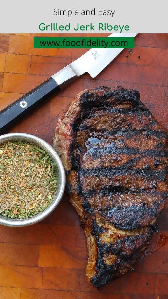grilled steak on a cutting board with jerk seasoning