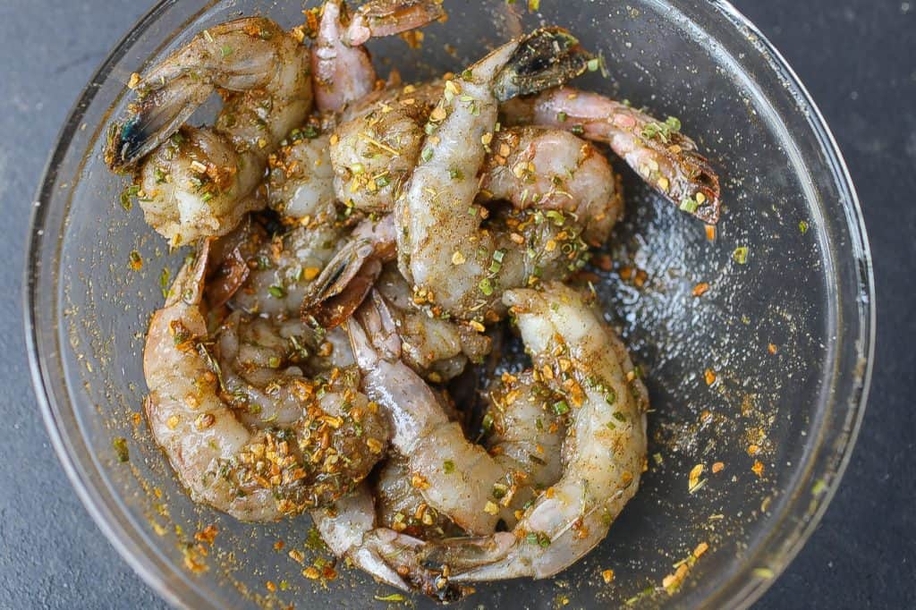 shrimp in bowl topped with seasoning