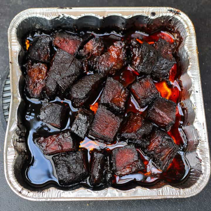 beef burnt ends in an aluminum pan