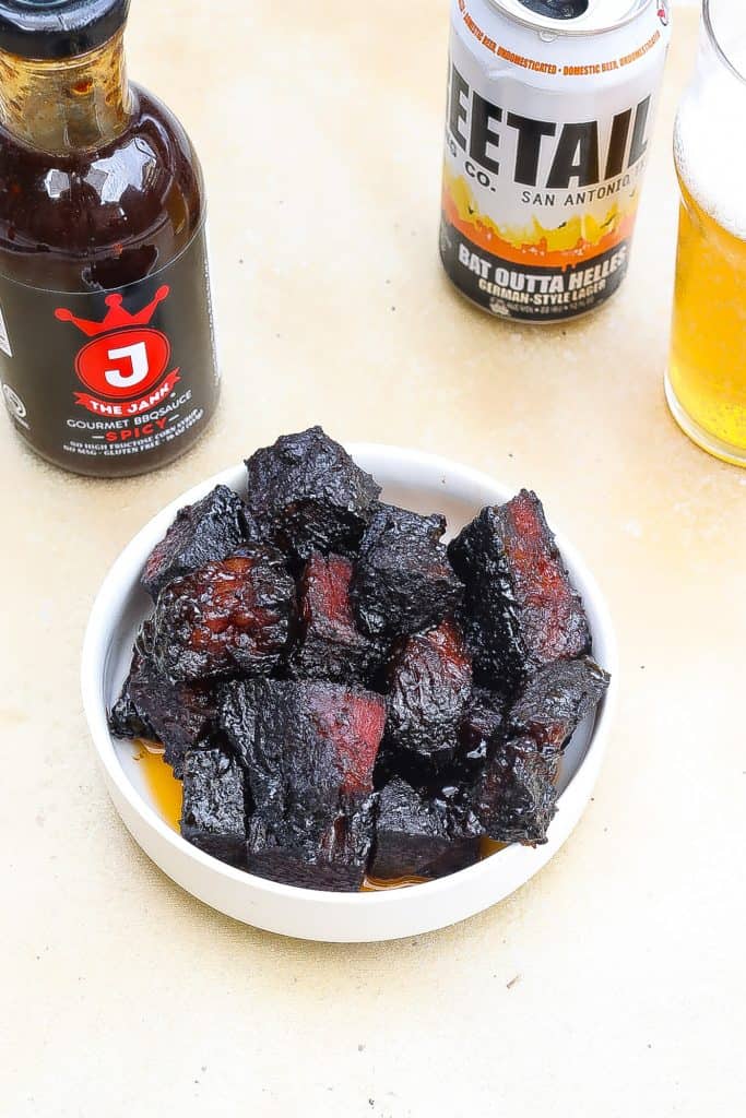 beef burnt ends in a white bowl