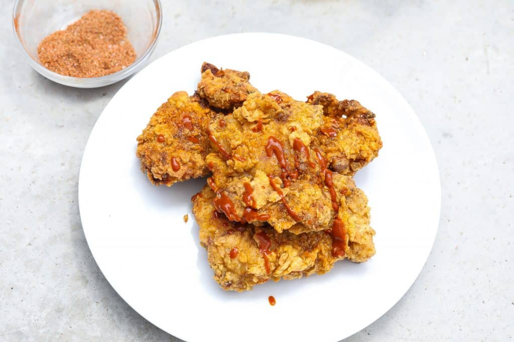 fried chicken thighs on white plate