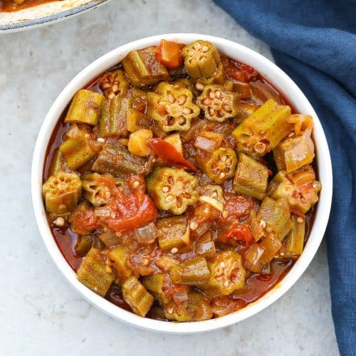 stewed okra and tomatoes in a white bowl