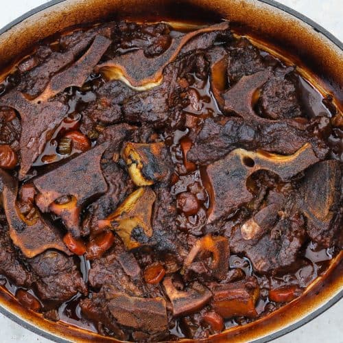 beef neck bones braising in a pot