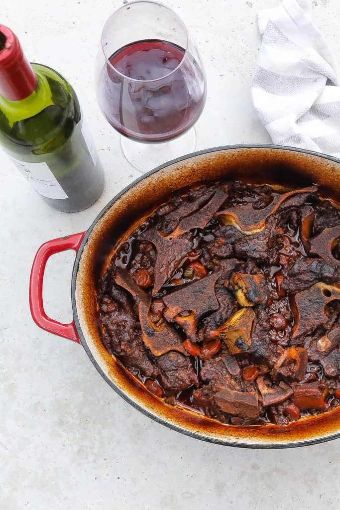 beef neck bones braising in a pot