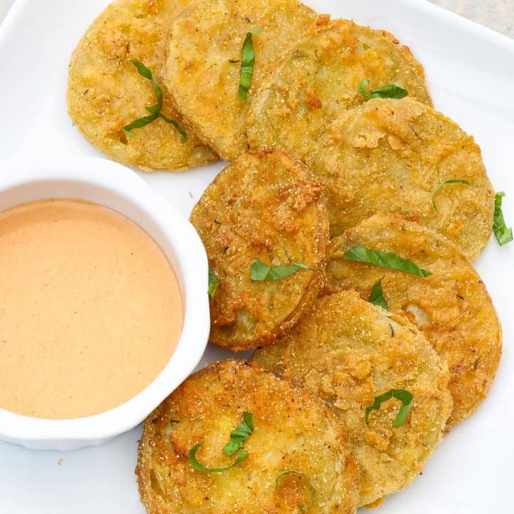 fried green tomatoes on a white plate
