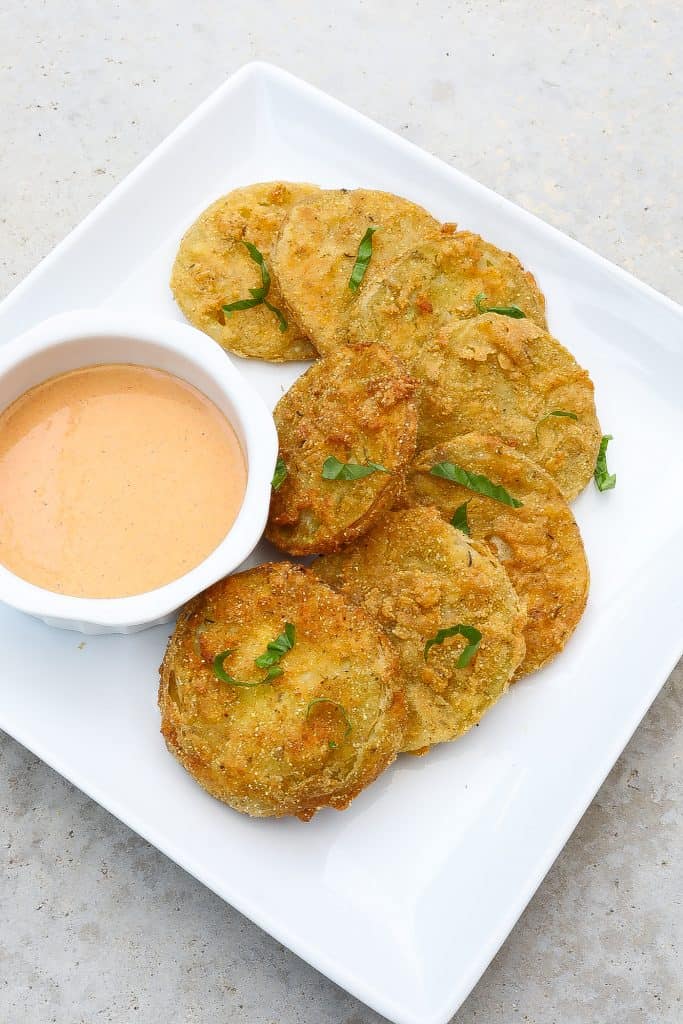 fried green tomatoes on a white plate