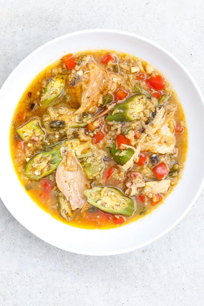 chicken and okra soup in a white bowl