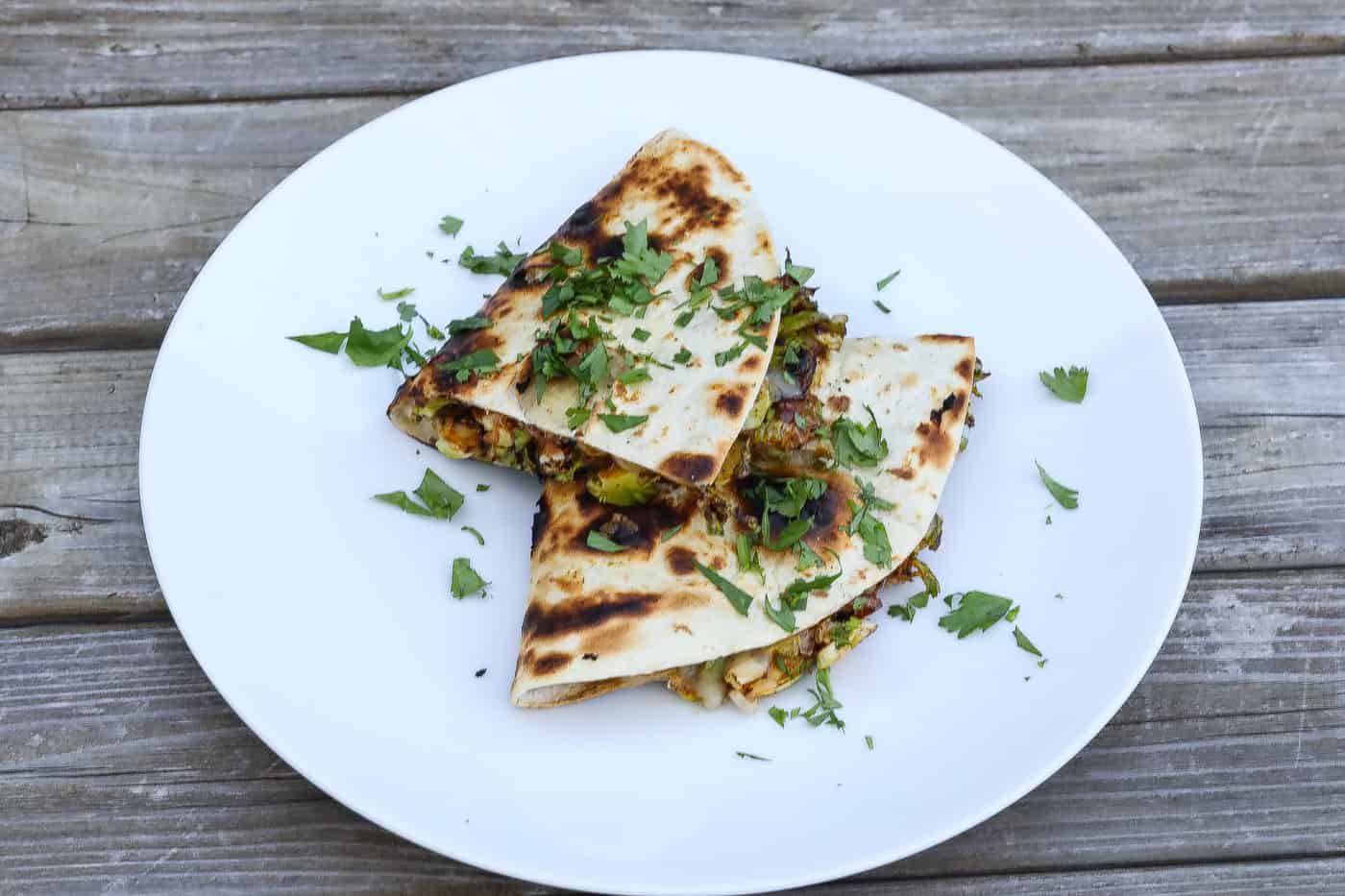 brussels sprouts quesadillas stacked on a plate
