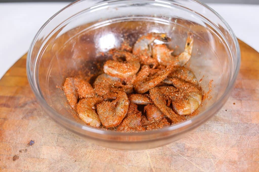 seasoned shrimp in a clear glass bowl
