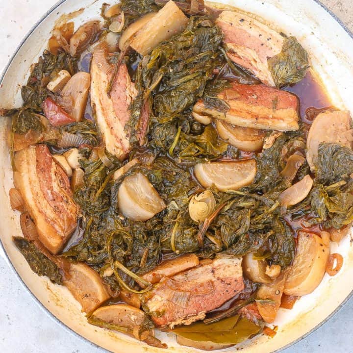 turnip greens with salt bacon and turnip roots in white pot