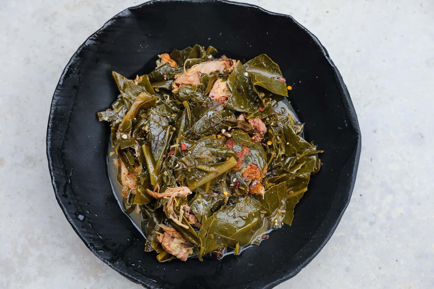 https://www.foodfidelity.com/wp-content/uploads/2021/10/collard-greens-in-black-bowl-tight-1.jpg