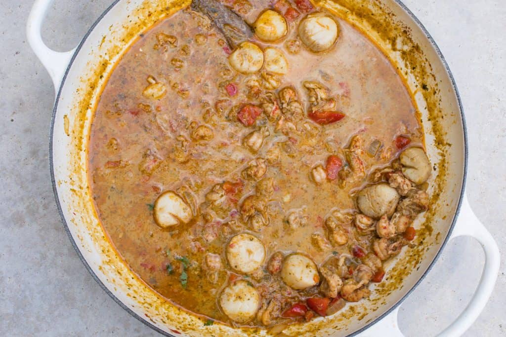 seafood stew in white pan